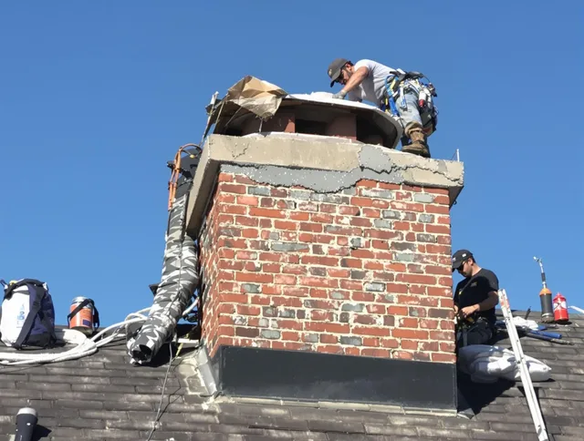 Grafton Chimney Sweep installing a custom chimney crown in Grafton, MA