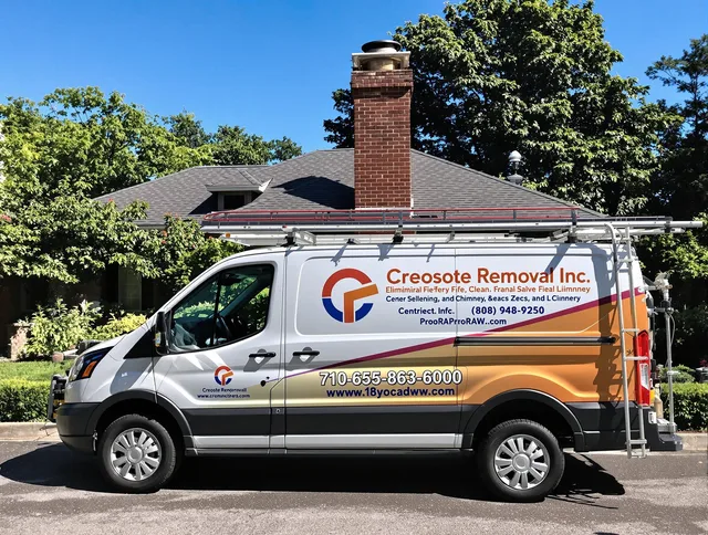 Grafton Chimney Sweep technician removing creosote safely in Grafton, MA