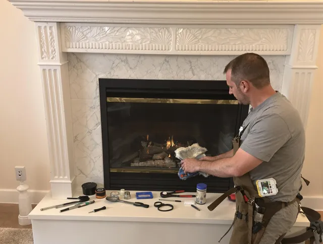 Grafton Chimney Sweep performing fireplace maintenance in Grafton, MA