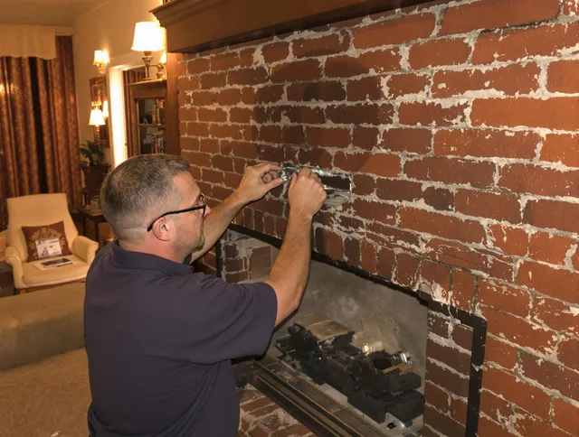 Grafton Chimney Sweep expert fixing a fireplace in Grafton, MA